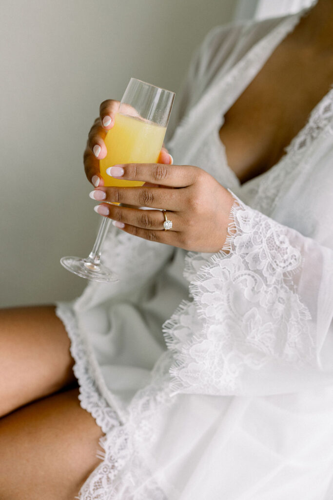 Tupper Manor Wedding | Newport RI Wedding Photographer Brianna Graca Weddings | Fine Art Editorial Imagery at Coastal Mansion Wedding Venues | Bride holding a champagne glass