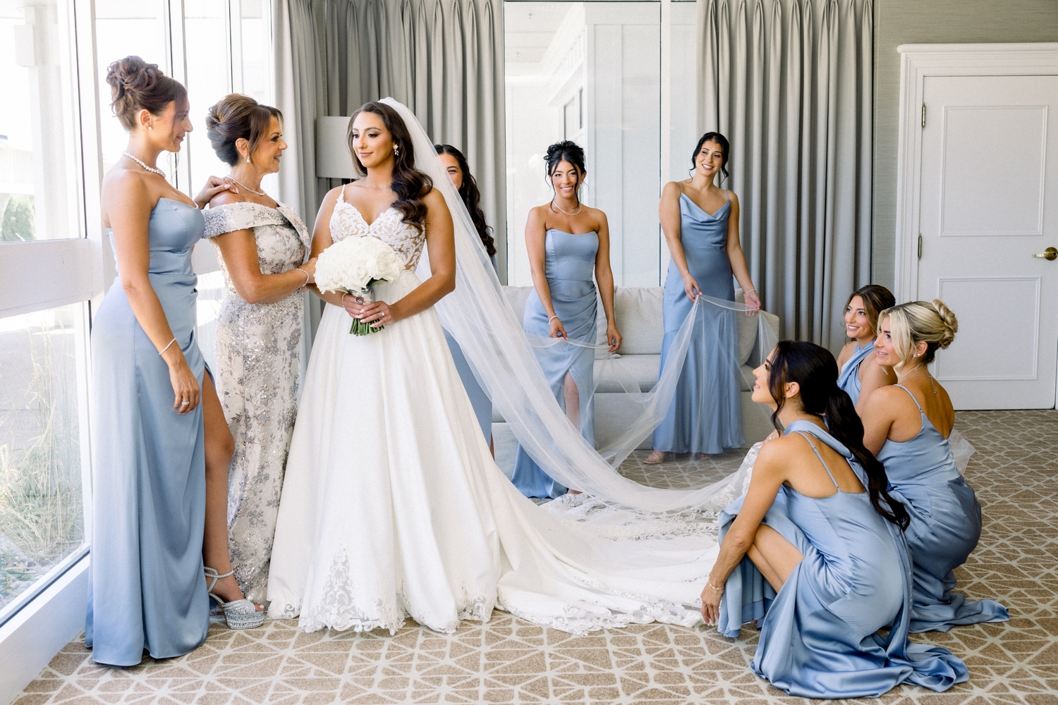 The bride poses in her lace gown before her Newport Harbor Island Resort Wedding.