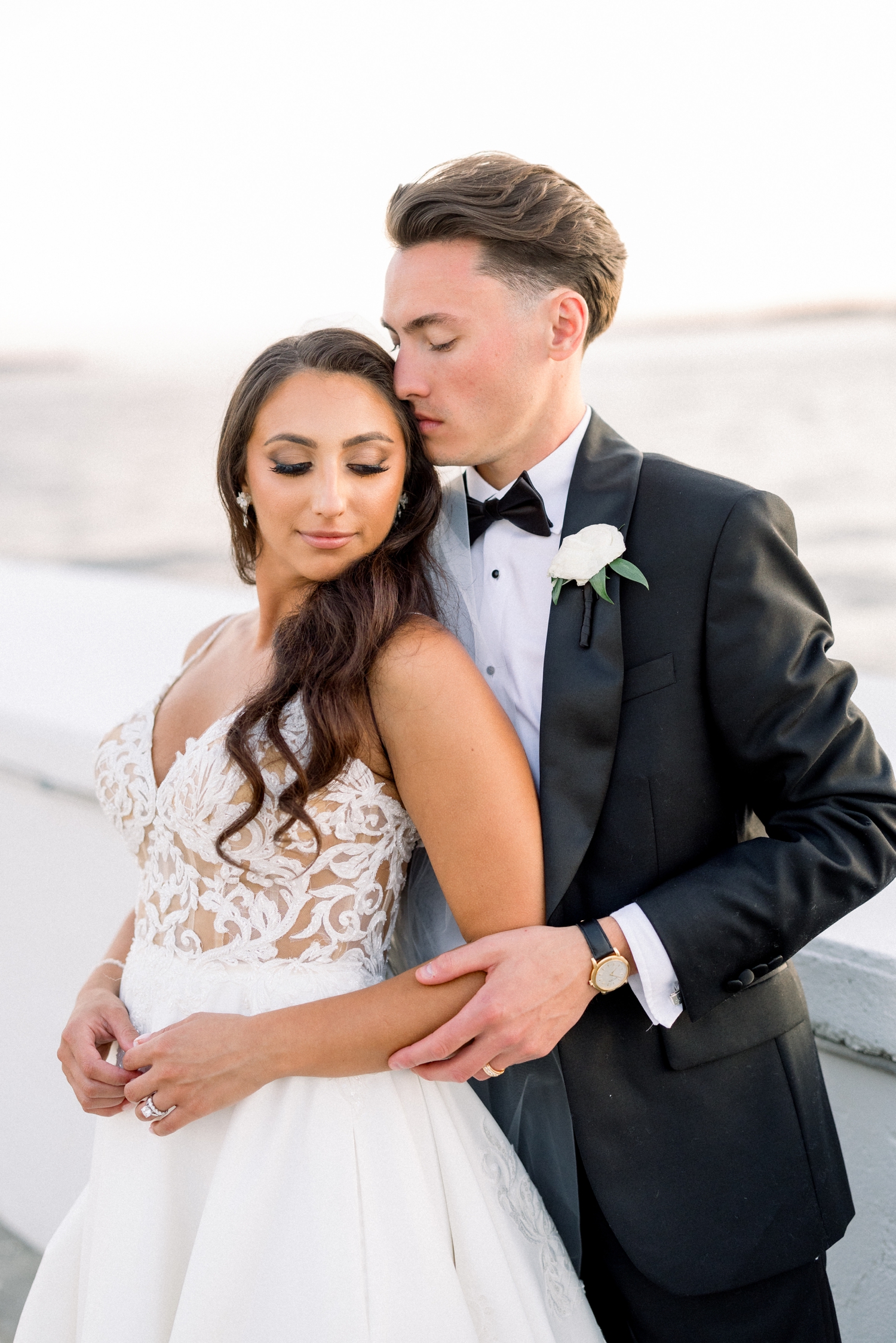 Sunset photos of bride and groom as A coastal black tie celebration unfolds at a Newport Harbor Island Resort Wedding.